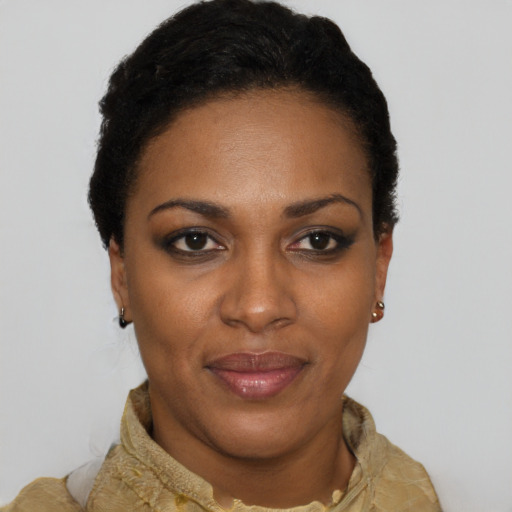 Joyful latino young-adult female with short  black hair and brown eyes
