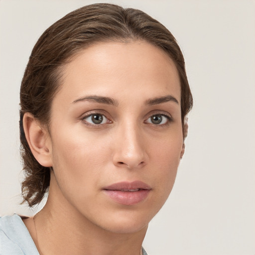 Neutral white young-adult female with medium  brown hair and brown eyes