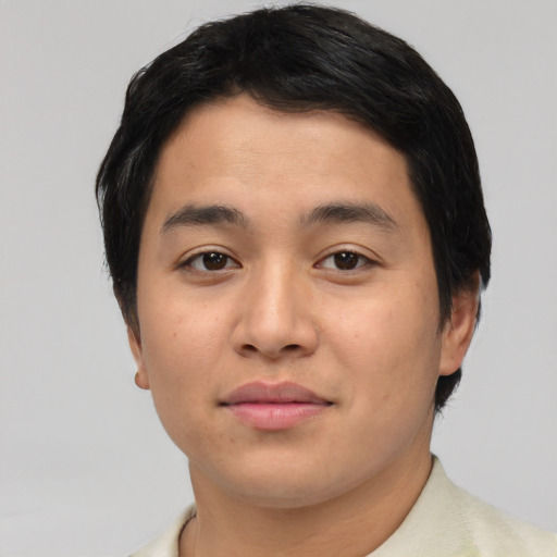 Joyful asian young-adult male with short  black hair and brown eyes