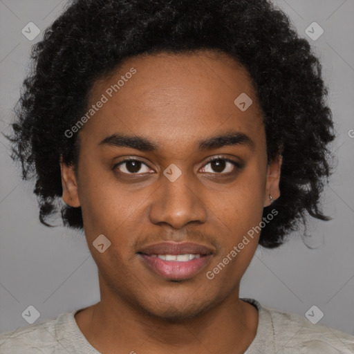 Joyful black young-adult male with short  brown hair and brown eyes