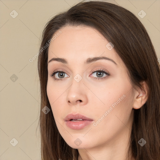 Neutral white young-adult female with long  brown hair and brown eyes