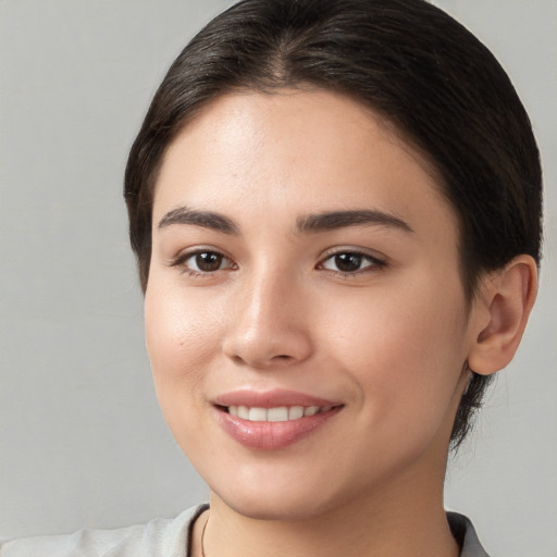 Joyful white young-adult female with medium  brown hair and brown eyes