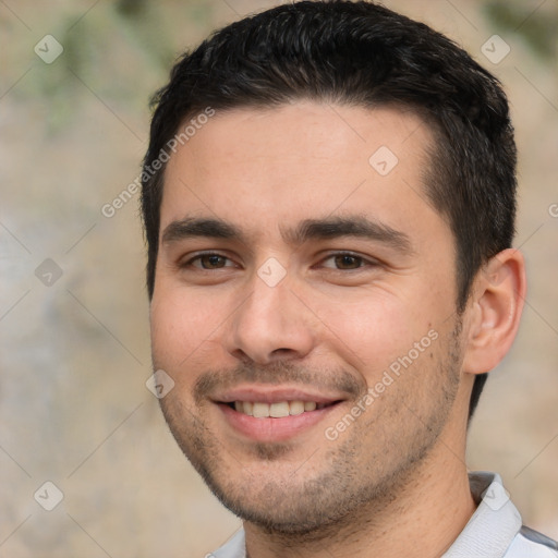 Joyful white young-adult male with short  black hair and brown eyes