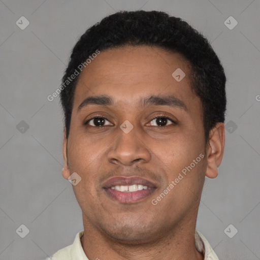 Joyful latino young-adult male with short  black hair and brown eyes