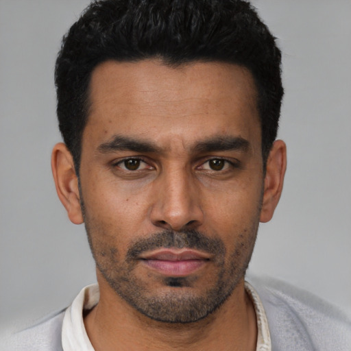 Neutral latino young-adult male with short  black hair and brown eyes