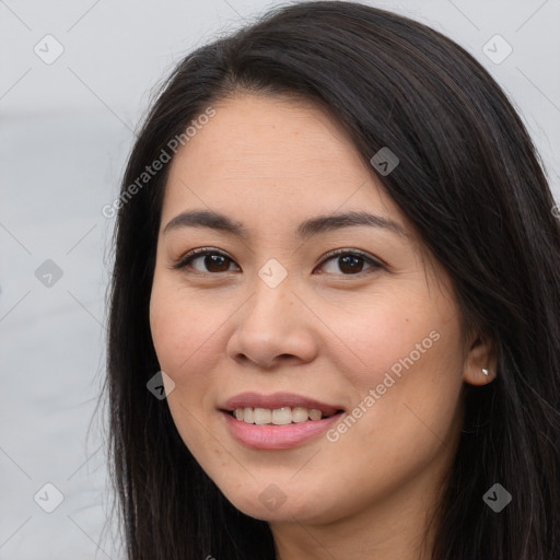 Joyful white young-adult female with long  brown hair and brown eyes