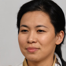 Joyful asian young-adult female with medium  brown hair and brown eyes