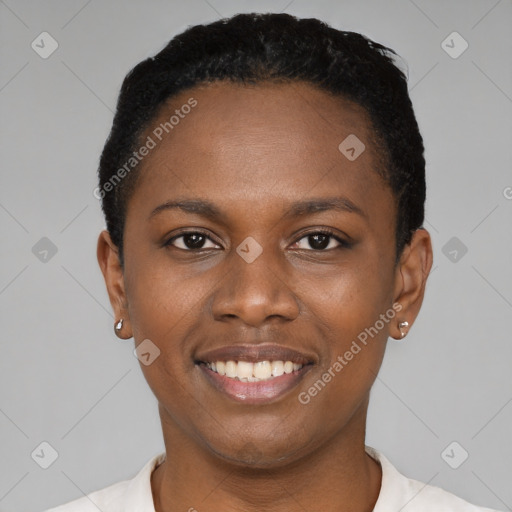 Joyful black young-adult female with short  black hair and brown eyes