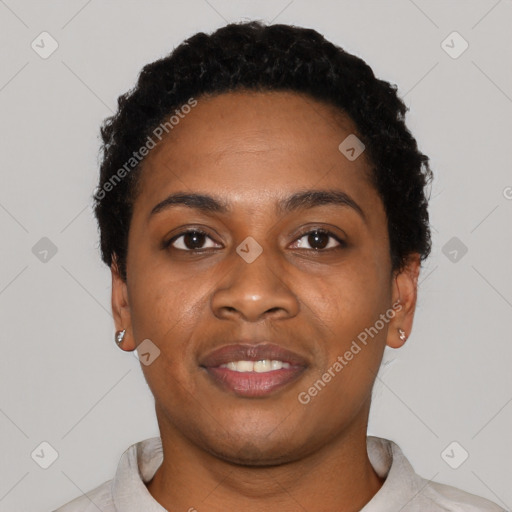 Joyful black young-adult female with short  black hair and brown eyes