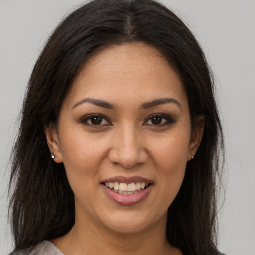 Joyful white young-adult female with long  brown hair and brown eyes
