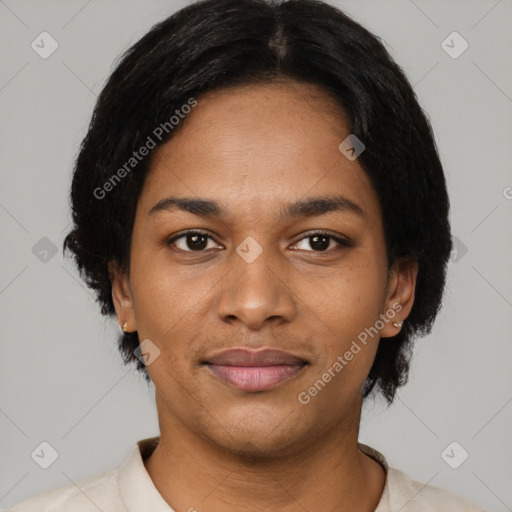 Joyful black young-adult female with short  black hair and brown eyes