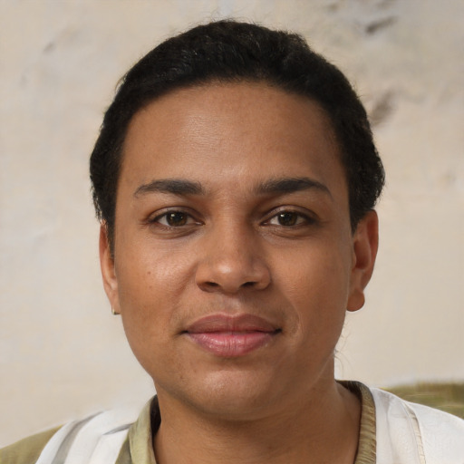 Joyful latino young-adult female with short  brown hair and brown eyes