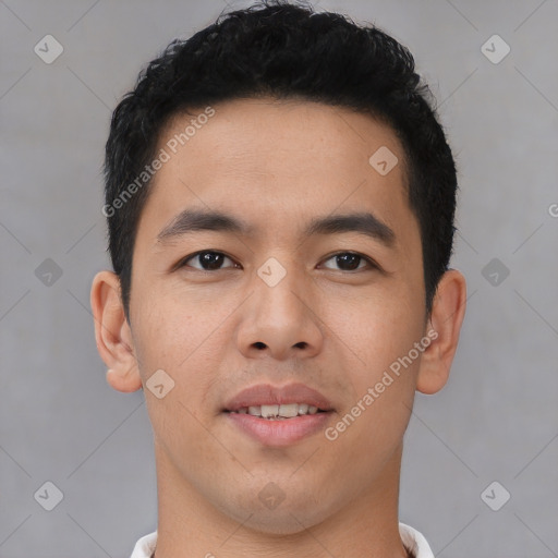 Joyful asian young-adult male with short  black hair and brown eyes