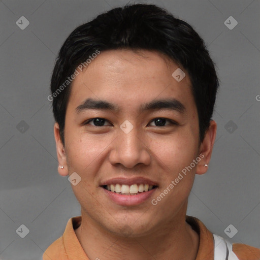 Joyful asian young-adult male with short  black hair and brown eyes