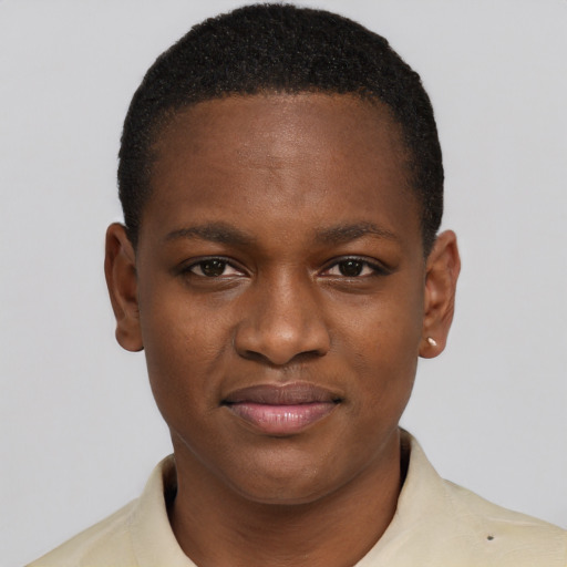 Joyful black young-adult female with short  brown hair and brown eyes