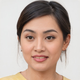 Joyful asian young-adult female with medium  brown hair and brown eyes