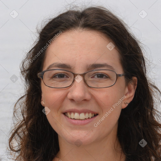 Joyful white adult female with long  brown hair and brown eyes