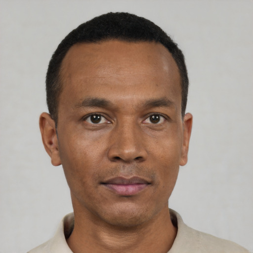 Neutral black young-adult male with short  black hair and brown eyes