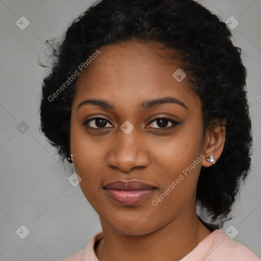 Joyful black young-adult female with long  black hair and brown eyes