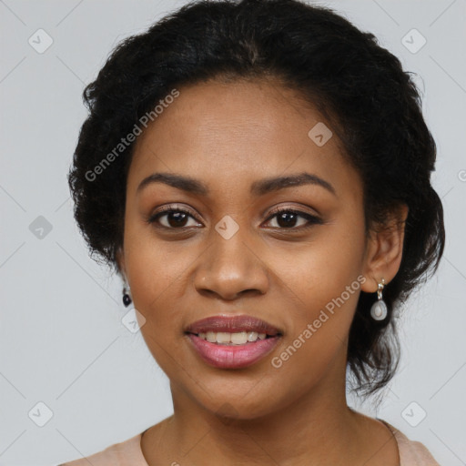 Joyful black young-adult female with long  black hair and brown eyes