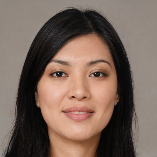 Joyful asian young-adult female with long  black hair and brown eyes