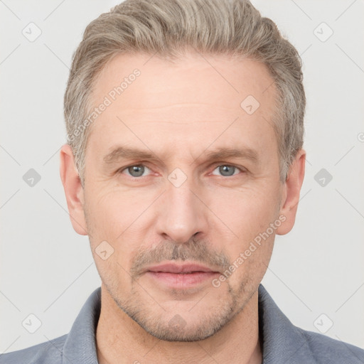 Neutral white adult male with short  brown hair and grey eyes