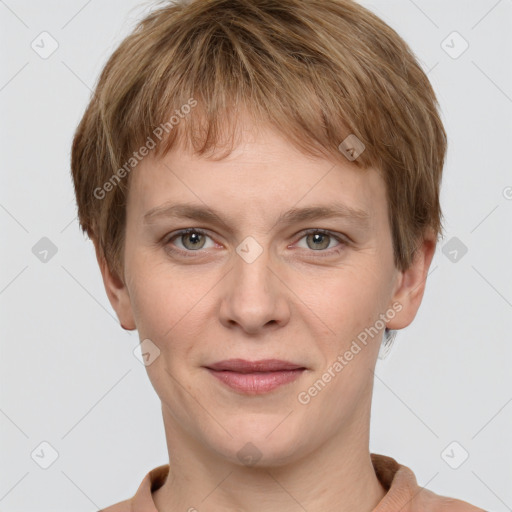 Joyful white young-adult female with short  brown hair and grey eyes