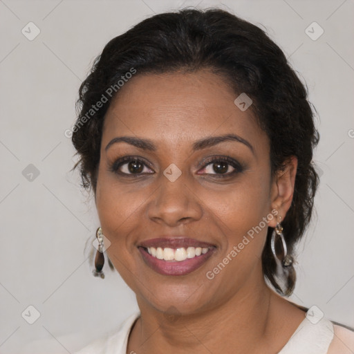 Joyful black adult female with medium  brown hair and brown eyes