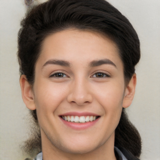 Joyful white young-adult female with long  brown hair and brown eyes