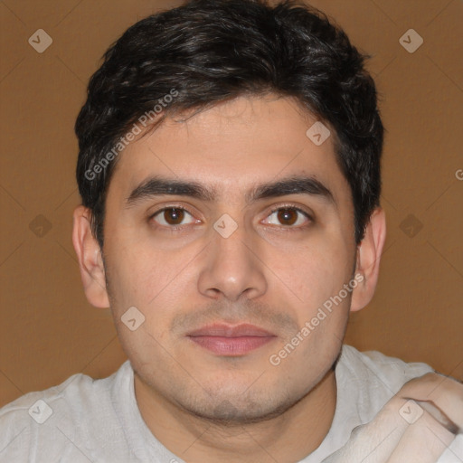 Joyful white young-adult male with short  black hair and brown eyes