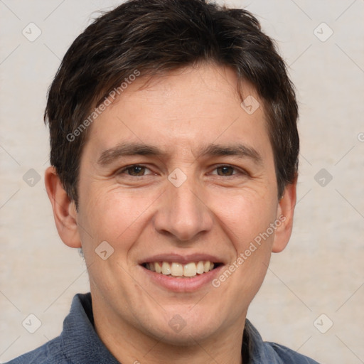 Joyful white adult male with short  brown hair and brown eyes