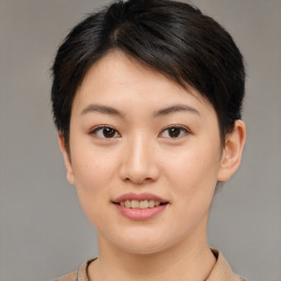 Joyful asian young-adult female with short  brown hair and brown eyes