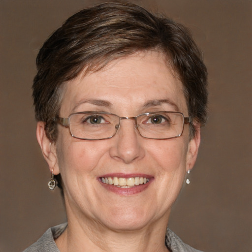 Joyful white adult female with short  brown hair and grey eyes