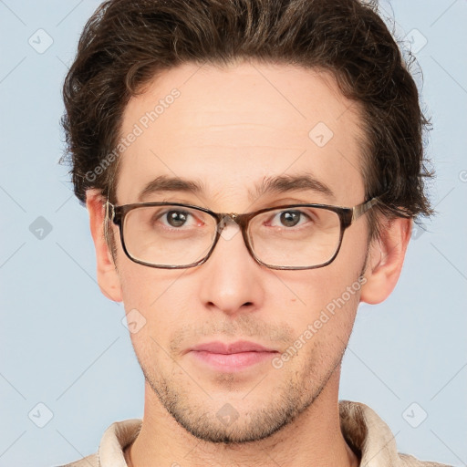 Neutral white young-adult male with short  brown hair and grey eyes