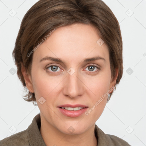 Joyful white young-adult female with short  brown hair and grey eyes