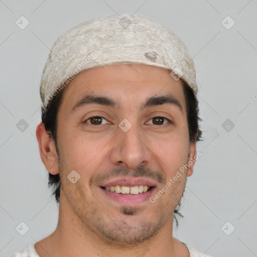 Joyful white young-adult male with short  black hair and brown eyes