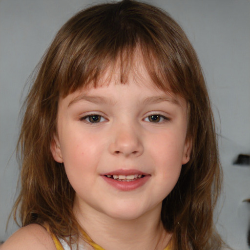 Joyful white child female with medium  brown hair and brown eyes