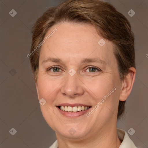 Joyful white adult female with medium  brown hair and brown eyes