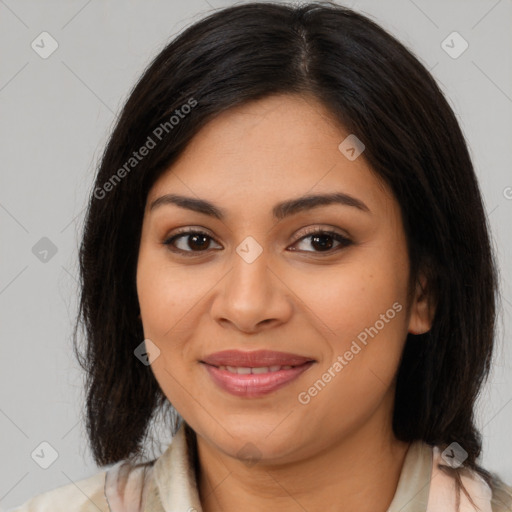 Joyful latino young-adult female with medium  brown hair and brown eyes