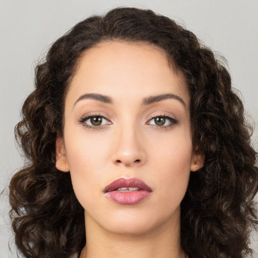 Neutral white young-adult female with long  brown hair and brown eyes