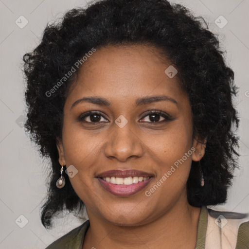 Joyful black young-adult female with long  brown hair and brown eyes