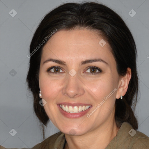 Joyful white adult female with medium  brown hair and brown eyes