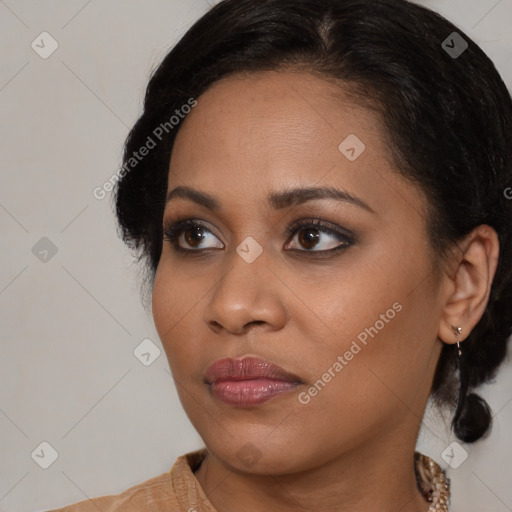 Joyful black young-adult female with medium  brown hair and brown eyes