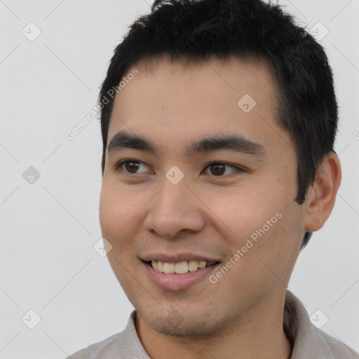 Joyful latino young-adult male with short  black hair and brown eyes