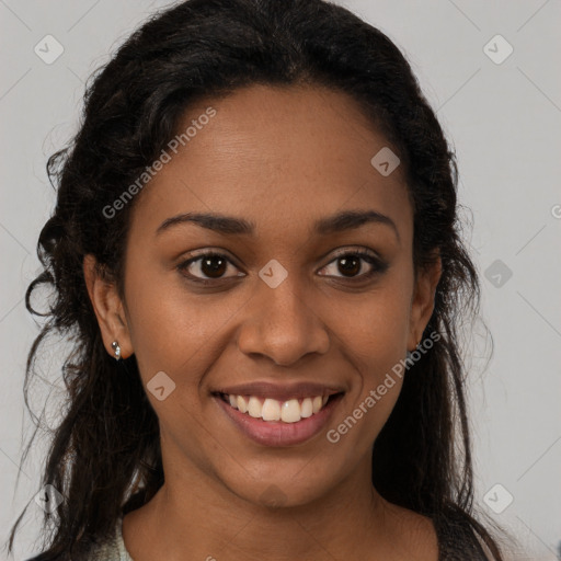 Joyful black young-adult female with long  brown hair and brown eyes