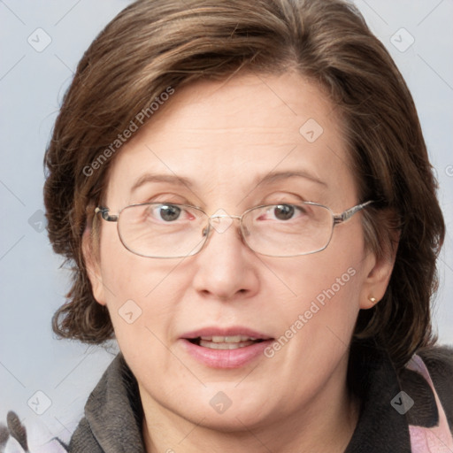 Joyful white adult female with medium  brown hair and blue eyes