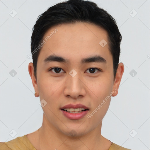 Joyful asian young-adult male with short  black hair and brown eyes