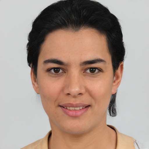 Joyful white young-adult female with short  black hair and brown eyes