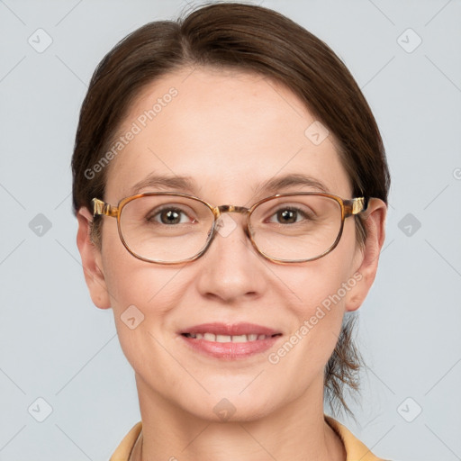 Joyful white adult female with short  brown hair and grey eyes