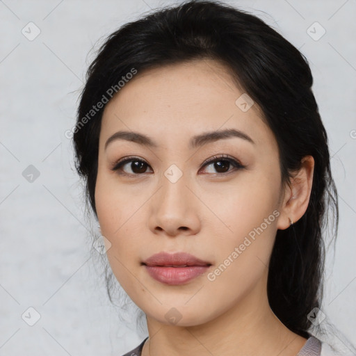 Joyful asian young-adult female with medium  black hair and brown eyes